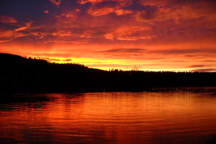 a sunset over a body of water