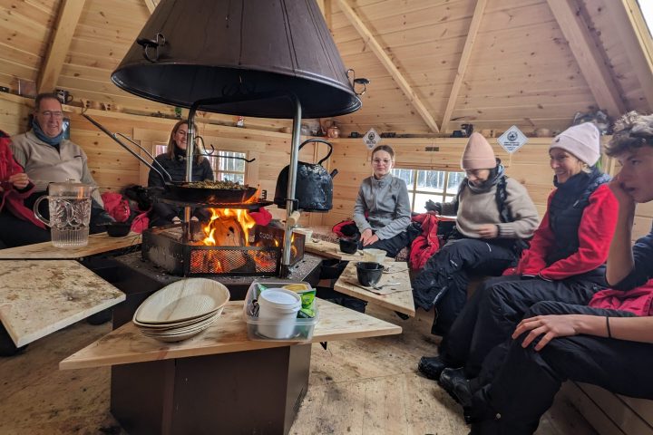 a group of people sitting at a table