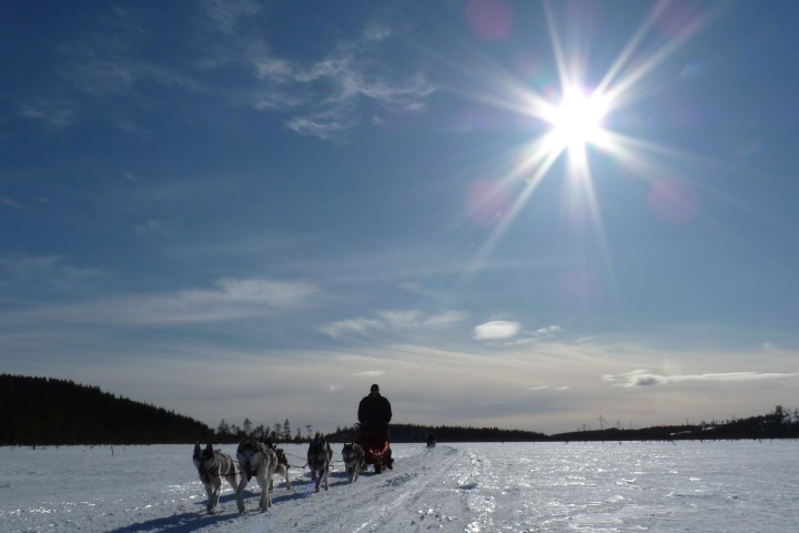 a couple of people that are standing in the snow
