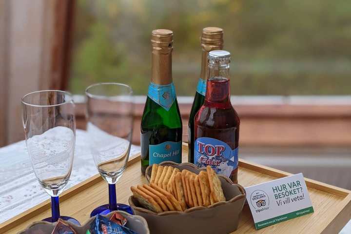 a bottle of wine sitting on top of a wooden table