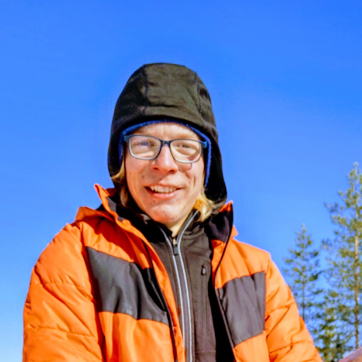 a person wearing an orange jacket